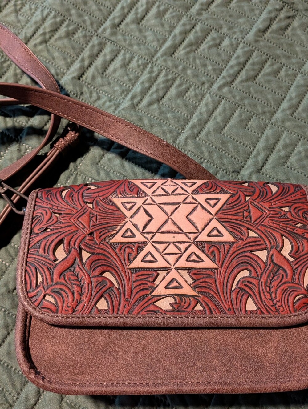Womenโs Brown Tooled Leather Crossbody Bag with Geometric Accent